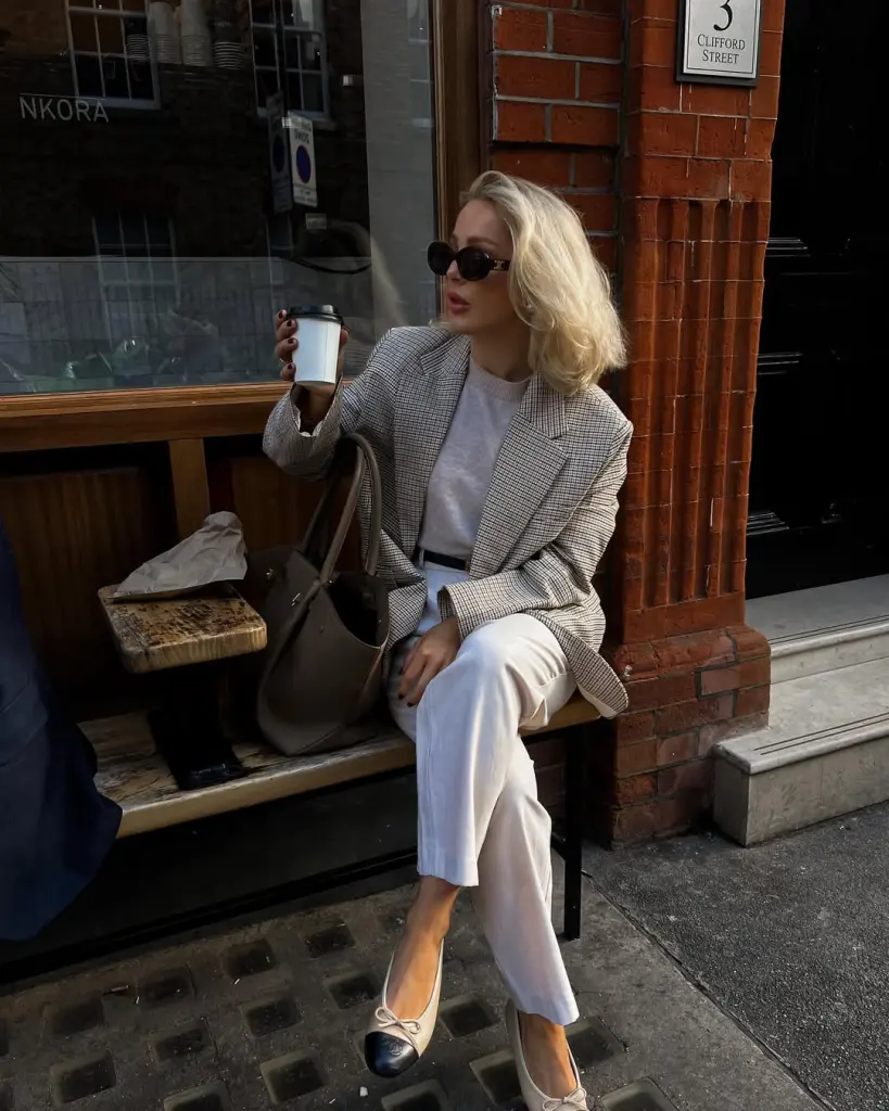 claasy outfit with beige plaid blazer, beige sweater, cream wide-leg trousers, black and beige ballet flats and taupe leather tote bag