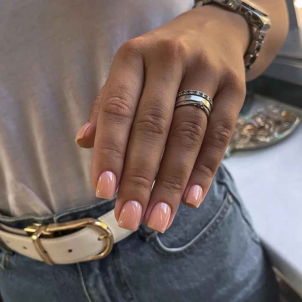Short square peach nude nails with high-shine glossy finish creating a timeless old money aesthetic perfect for spring