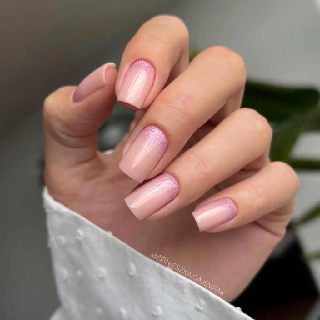 Light pink nails with glitter base accent on square nails
