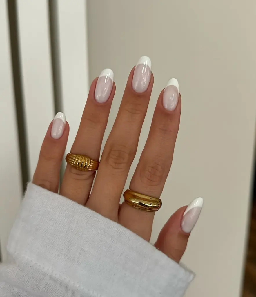 Oval french tip nails with milky base
