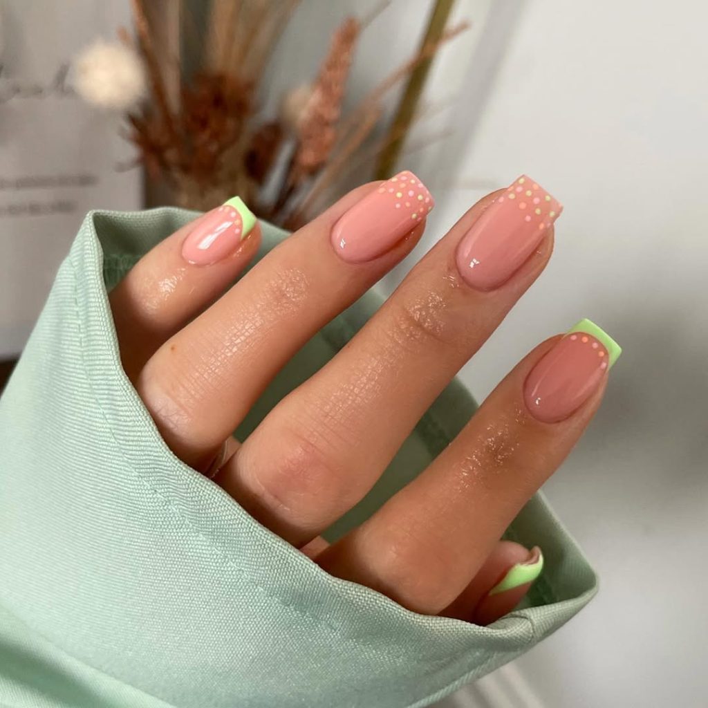 Neutral pink square nails with mint green french tips and colorful fots