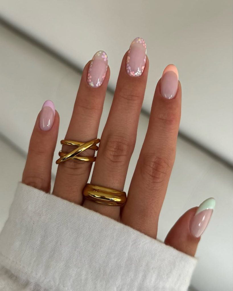 milky nails with pastel flowers and peach French tips