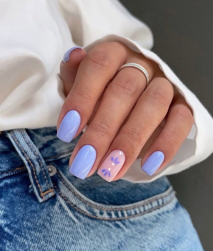 Short lavender nails with purple floral accent
