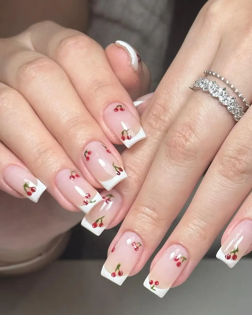 Square French tips with scattered cherry pattern