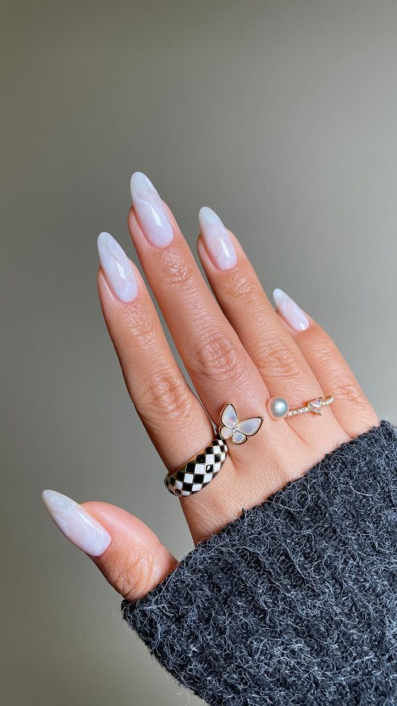 White almond nails with pearly marble effect
