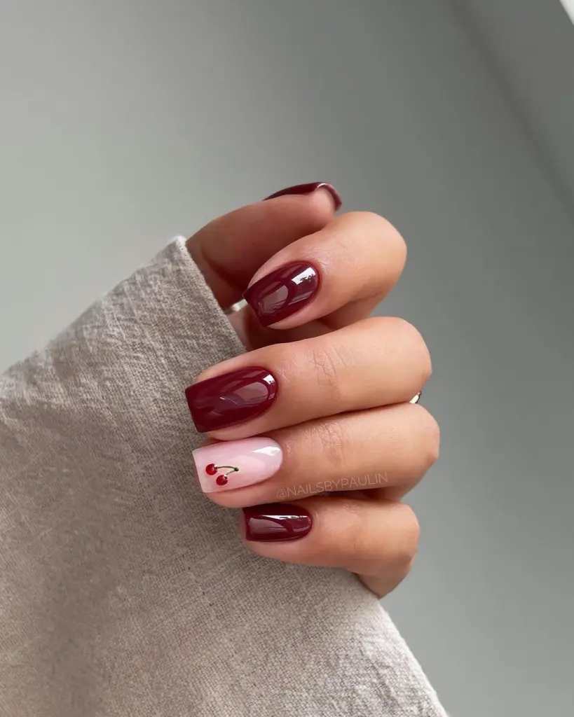 Wine red short nails with cherry accent design