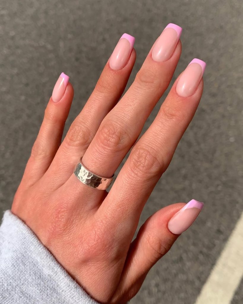 Square french tip nails with light pink tips
