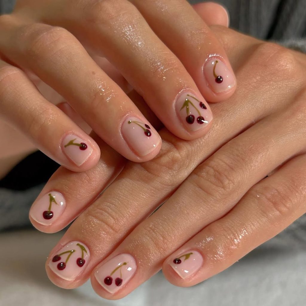 Short natural nails with minimal cherry art
