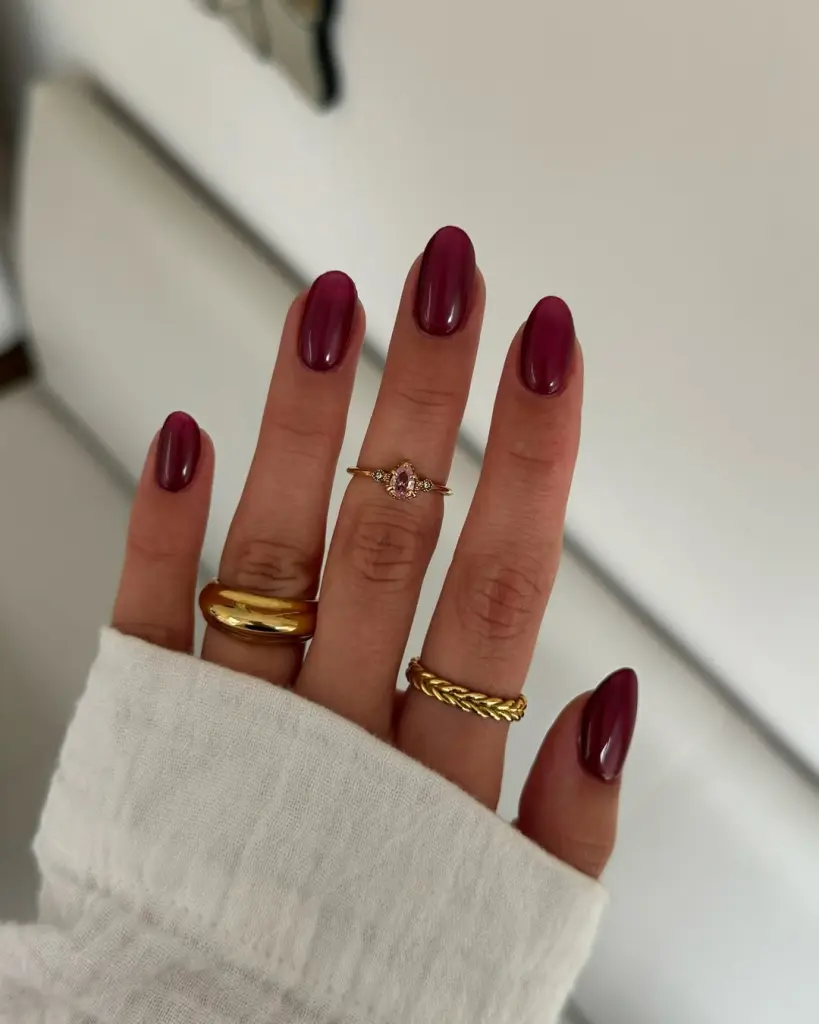 Classy and Glossy burgundy polish on almond shaped nails