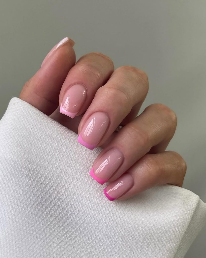 Short square nails with french tip nails with different shades of pink
