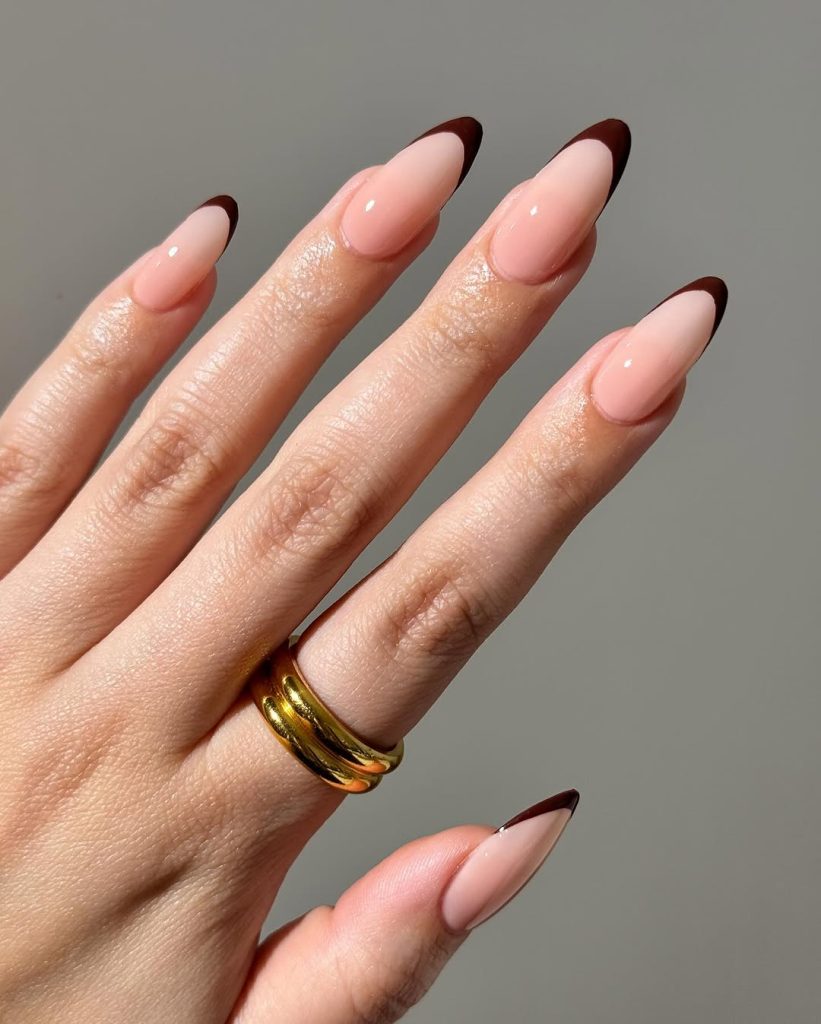 Almond french tip nails with brown tips
