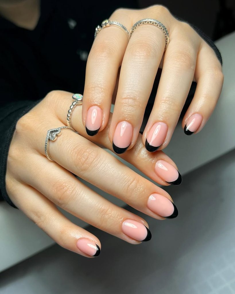 Oval french tip nails with black tips
