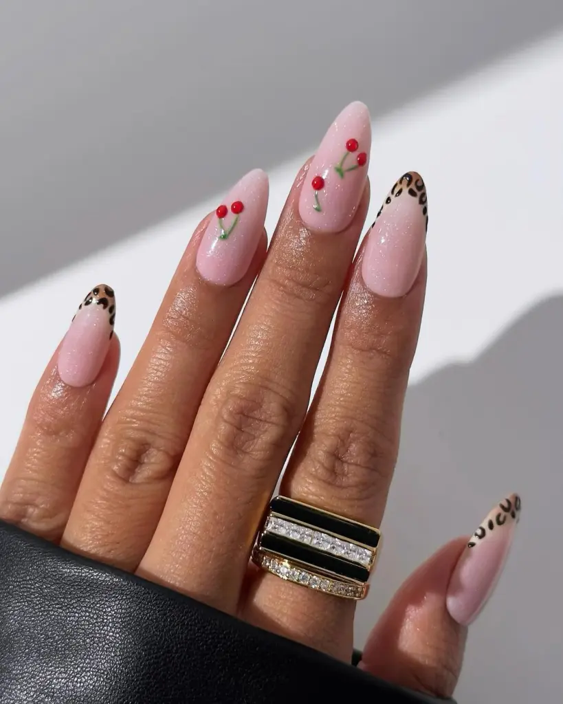 Simple cherry and animal print accents on almond shaped nails