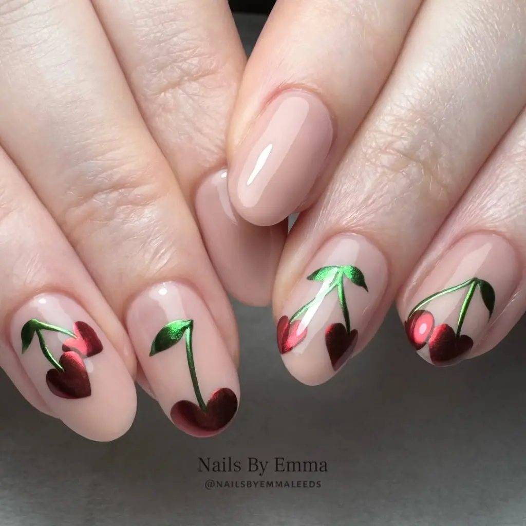 Pink nude nails with metallic cherry art