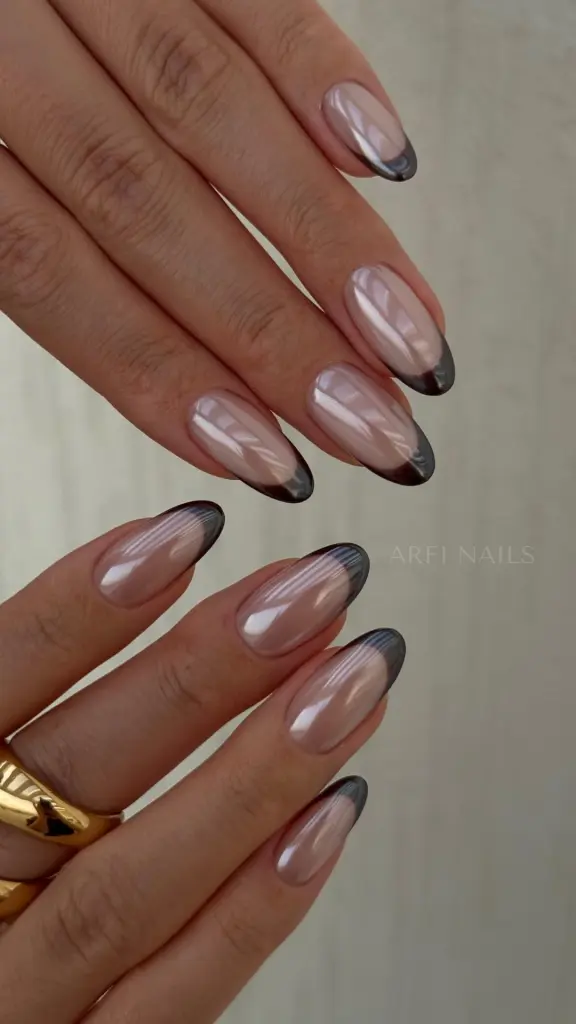 Almond french tip nails with chrome black tips
