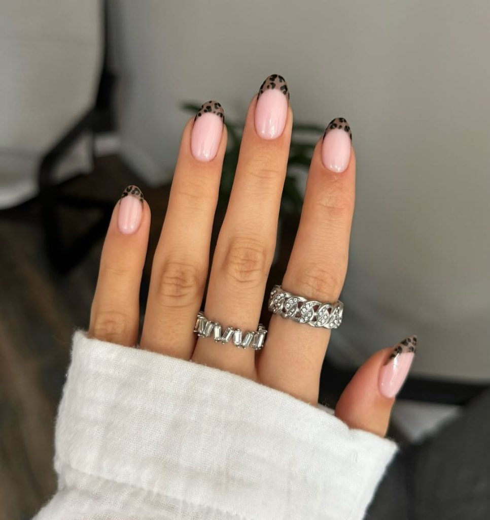 Almond french tip nails with leopard print tips
