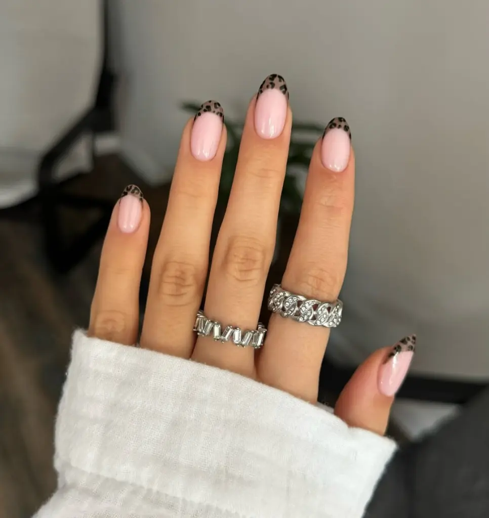 Almond french tip nails with leopard print tips
