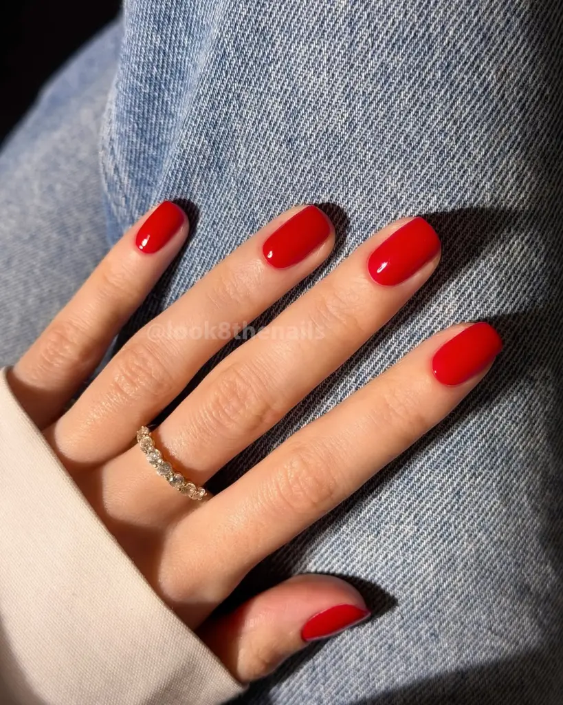 Short oval old money nails with bright red polish