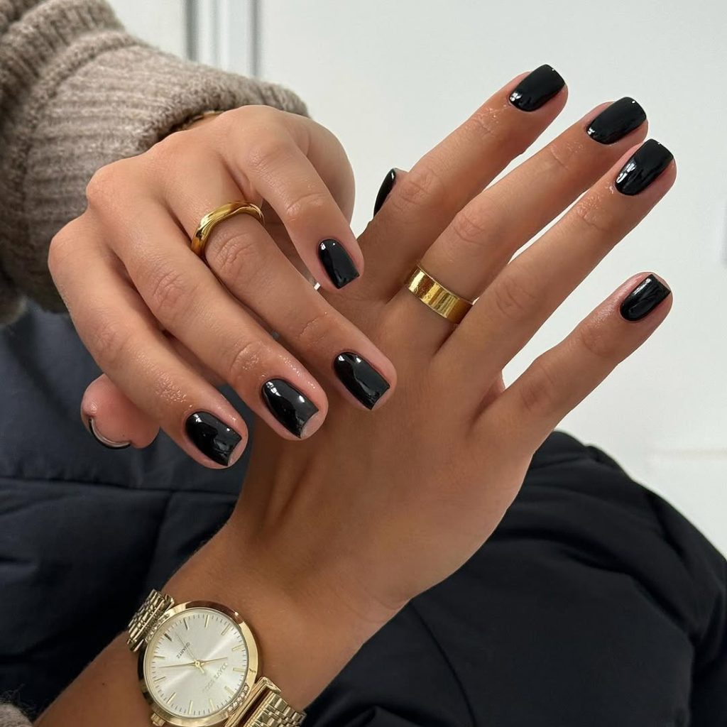 Short square classy nails with glossy black polish
