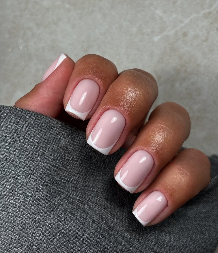 Short square french tip nails with white tips
