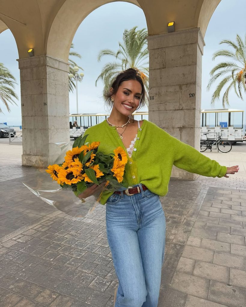 Cheerful spring outfit with lime green button-front cardigan, white lace camisole, light wash straight-leg jeans, brown leather belt and pearl necklace