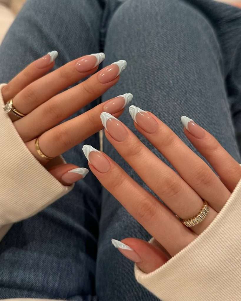  Long almond nails with nude base and 3D white wave French tips
