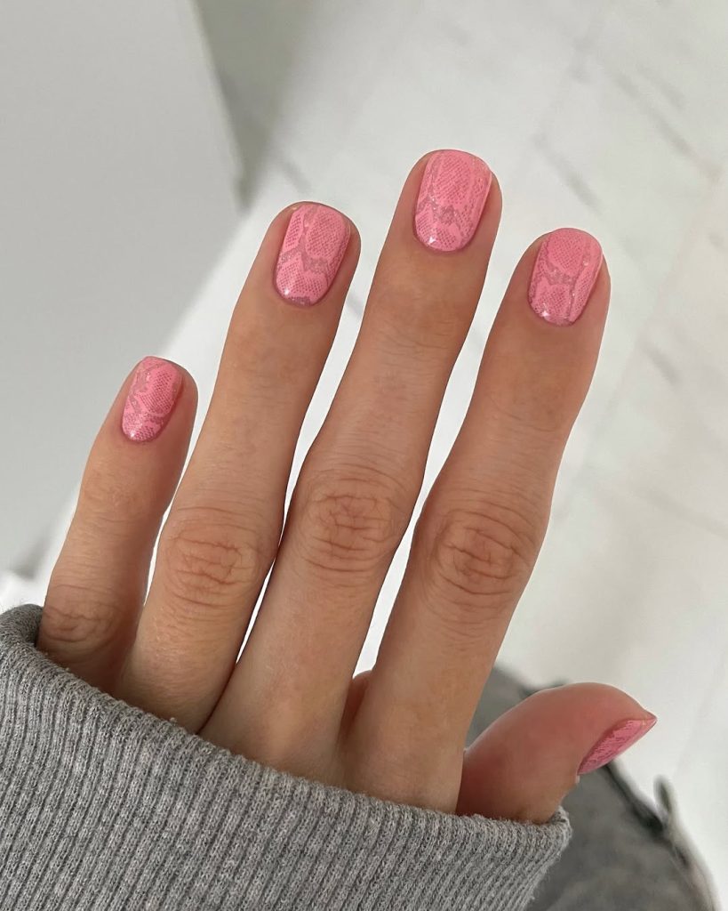 Short square nails with light pink snake print texture pattern