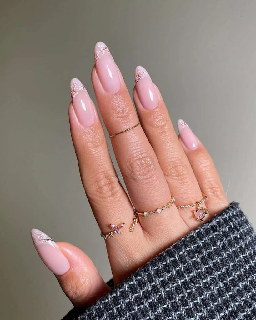 Almond nails with pink base and cherry blossom floral tip designs
