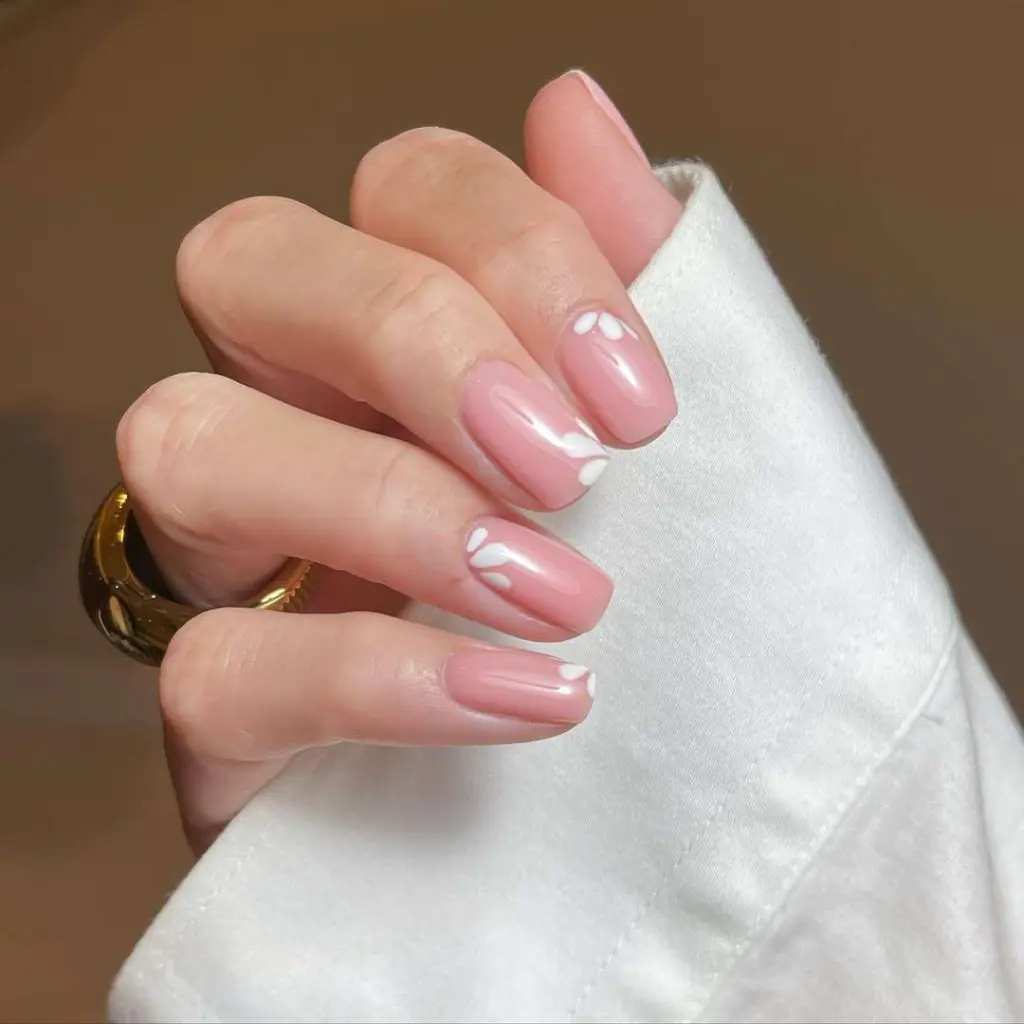  short square nails with glossy pink base and white flower details
