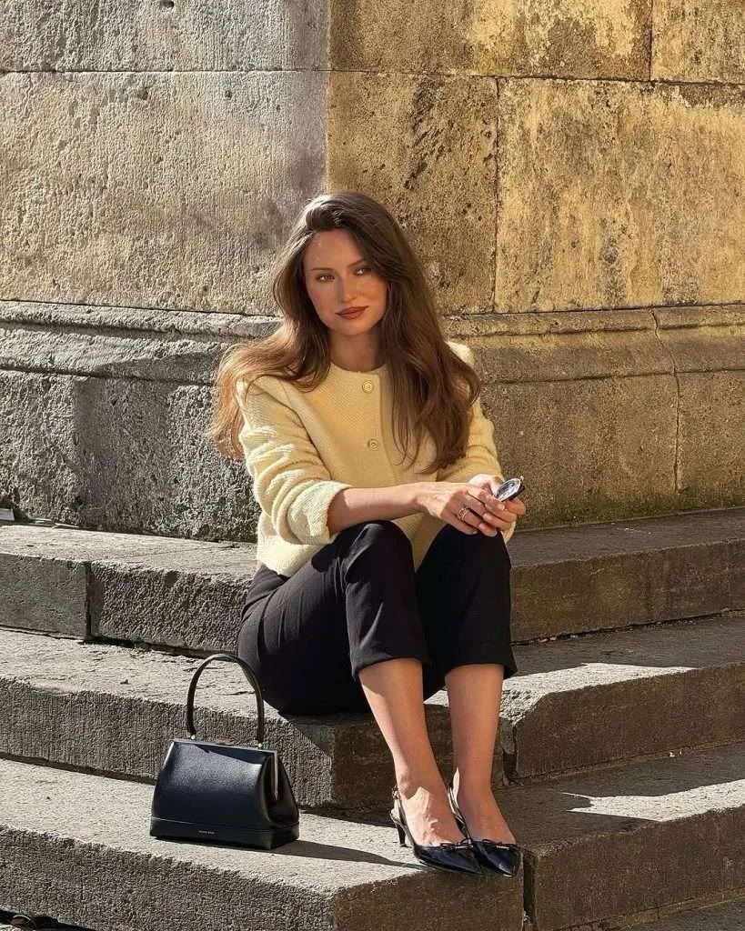 Classy spring outfit with cream boucle jacket, black cropped trousers, black slingback heels and black top-handle bag