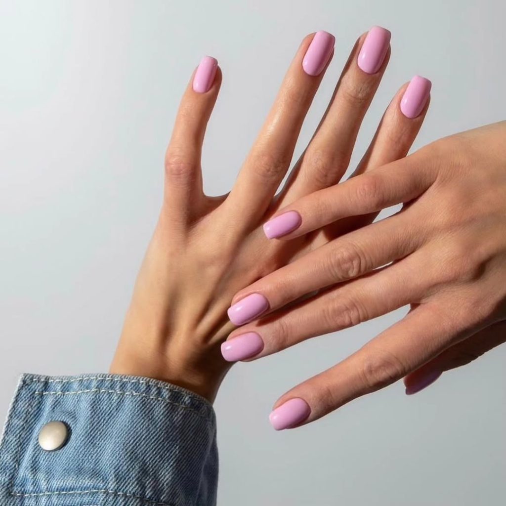 Short squoval nails with uniform matte lavender pink polish