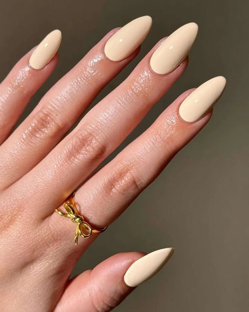 almond nails in glossy cream vanilla polish
