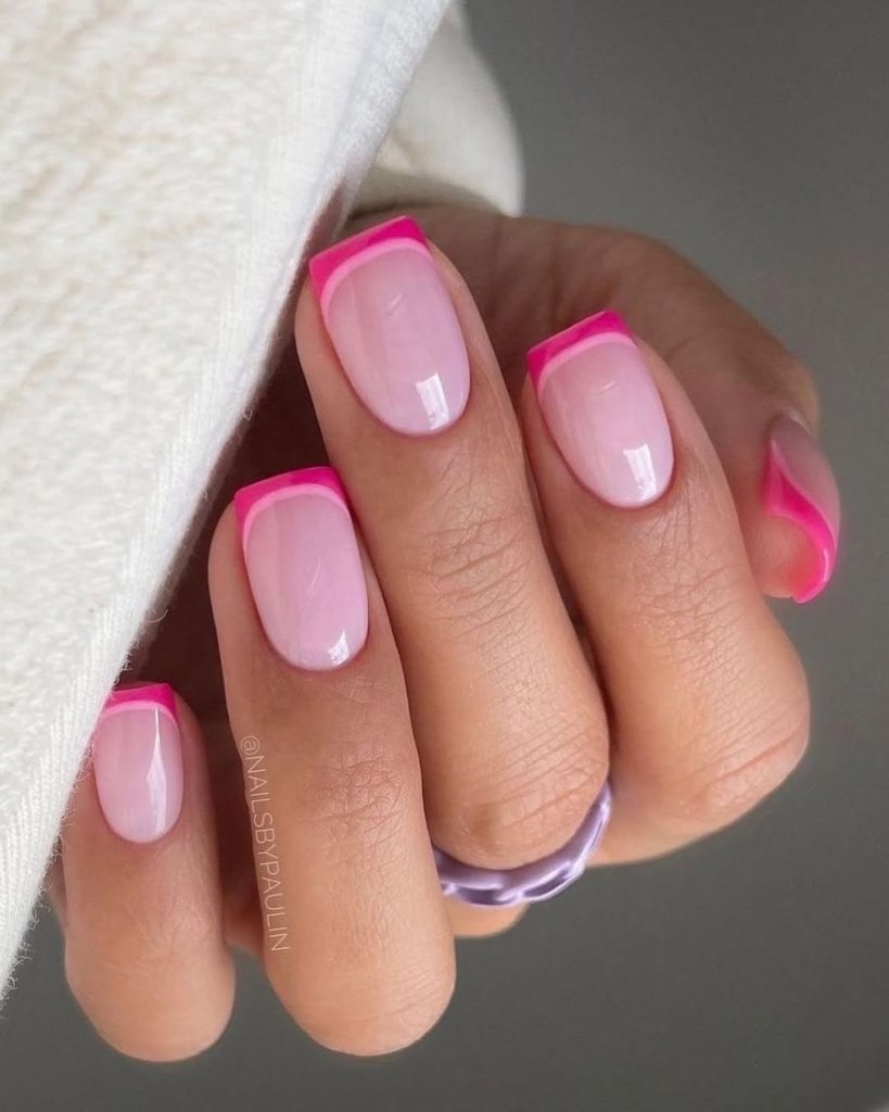 Short square nails with translucent pink base and hot pink French tips 
