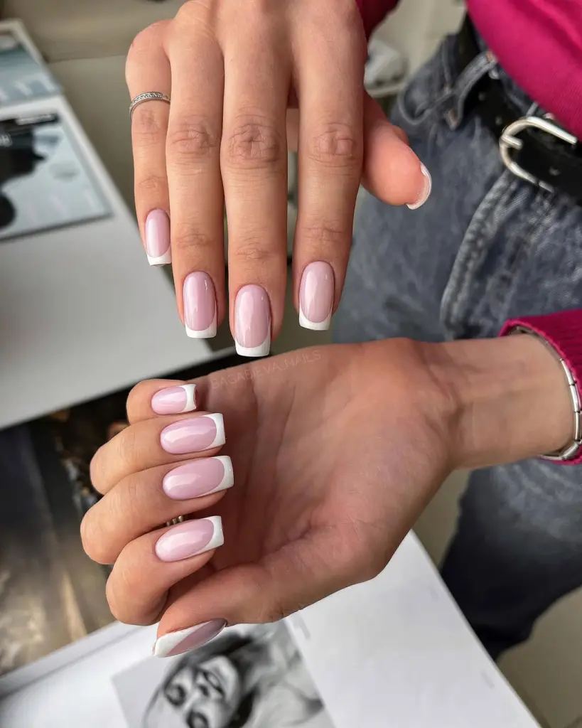 Square-shaped nails with glossy pink base and crisp white French tips, offering timeless elegance
