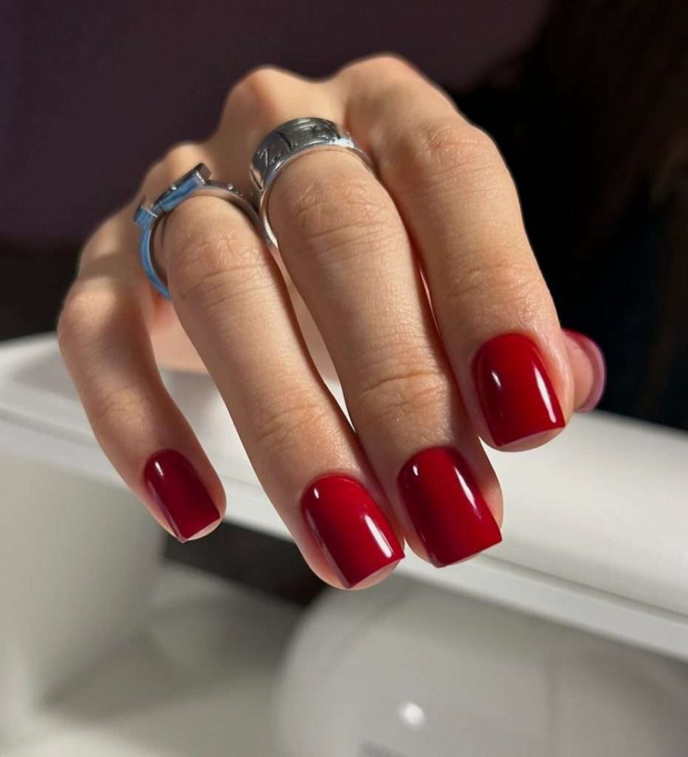 Short square nails with glossy deep red polish classic manicure