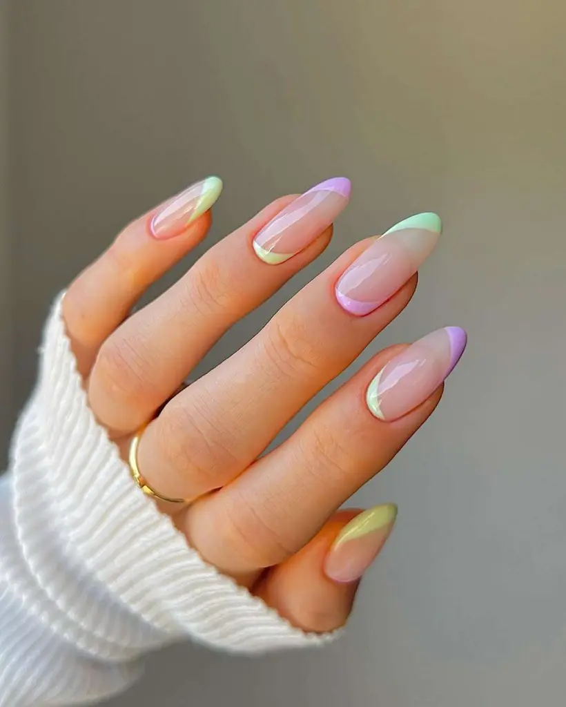 almond nails with transparent base and pastel mint and lavender side accents