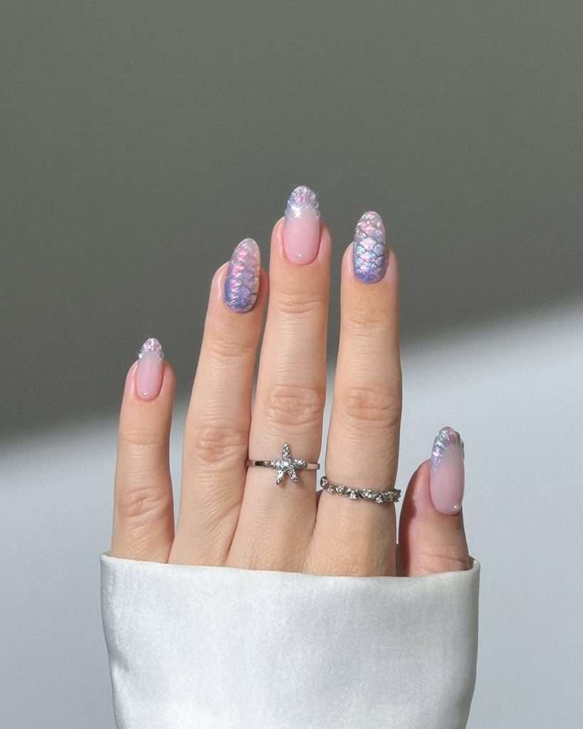  Long almond nails with pink base and iridescent mermaid scale design in blue and purple 