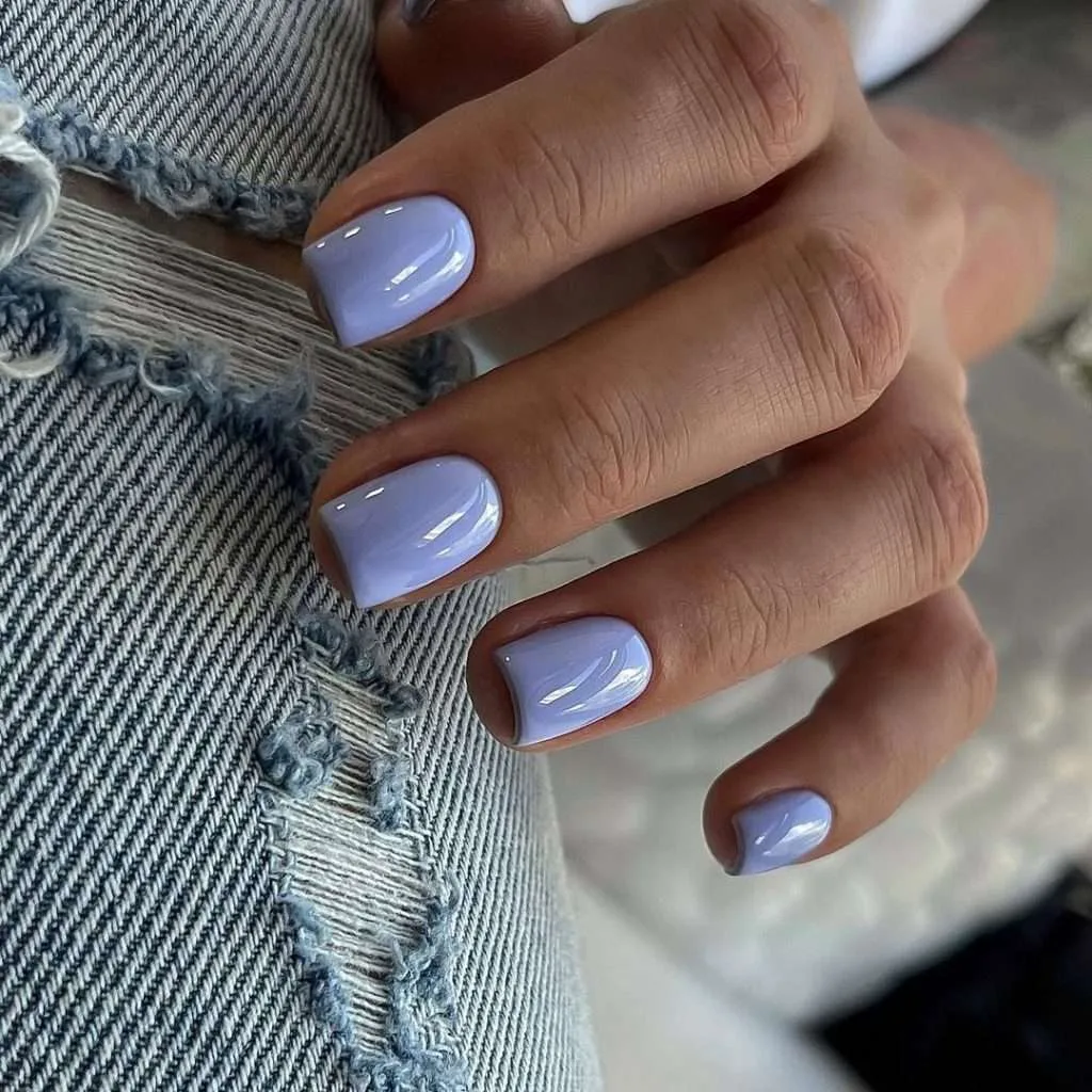 Short square nails in glossy periwinkle lavender polish