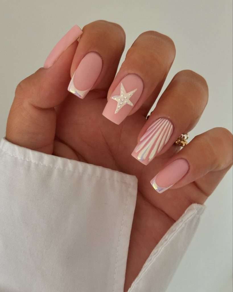 Long square nails with pink base, white seashell design and starfish accent 