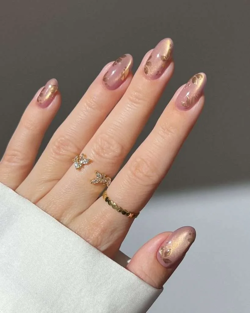 Short almond spring nails with pink chrome base and gold flower design