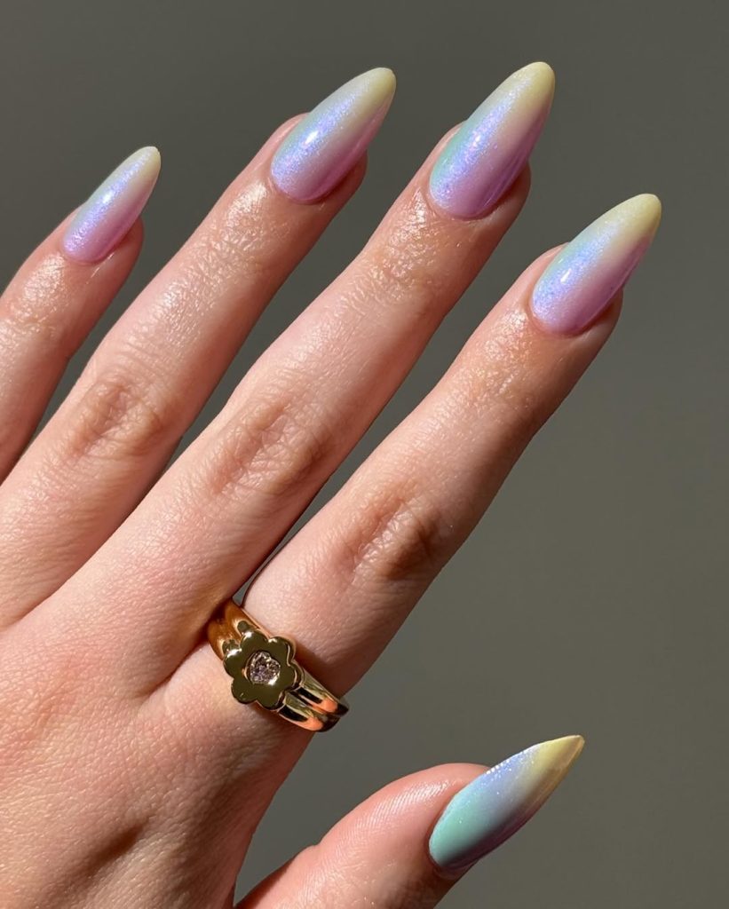 Long almond summer nails with pearlescent ombré effect blending lavender and yellow with iridescent shimmer
