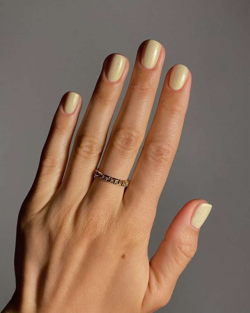  Short square nails in pearlescent champagne chrome finish
