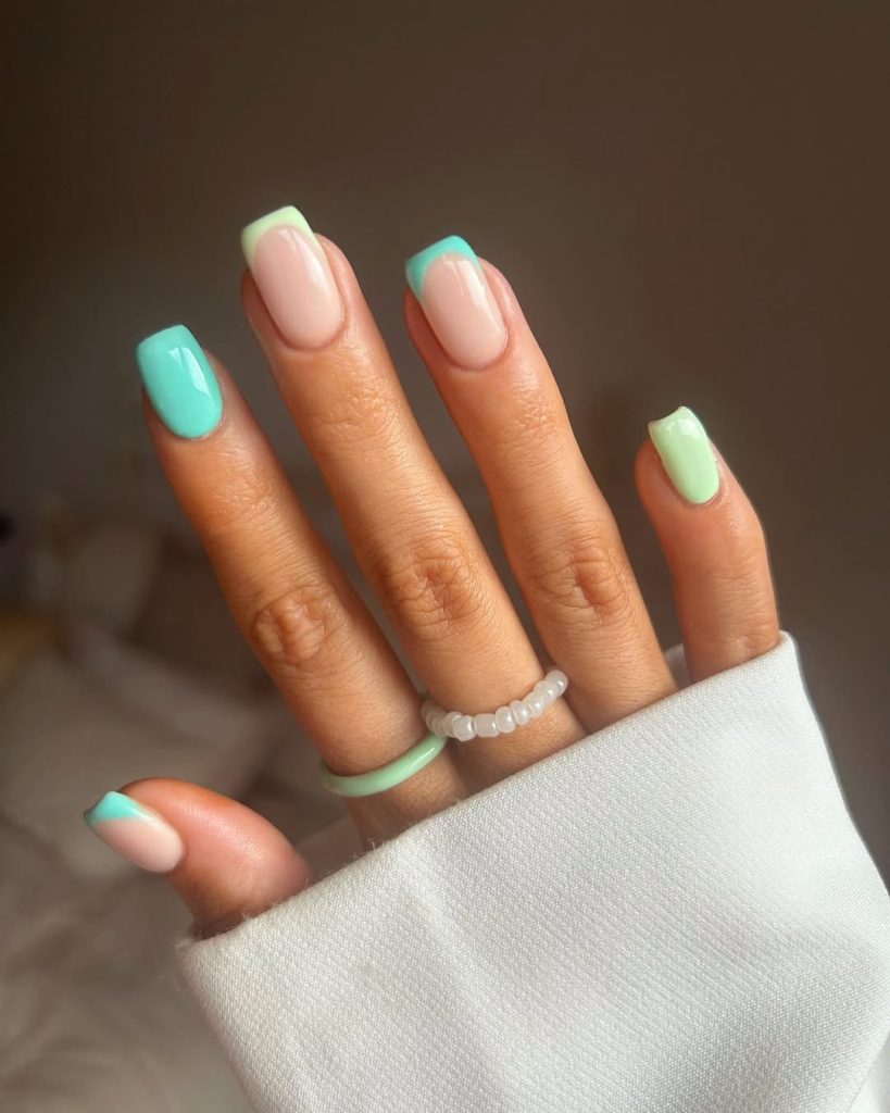 Short square summer nails with mix of milky base with mint tips, full aqua blue, and pale mint polish
