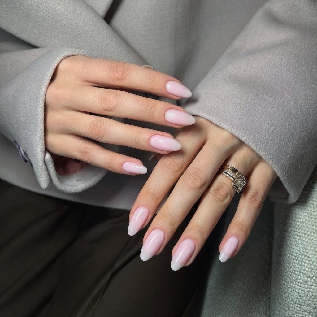 Almond-shaped minimalist nails with translucent milky pink polish