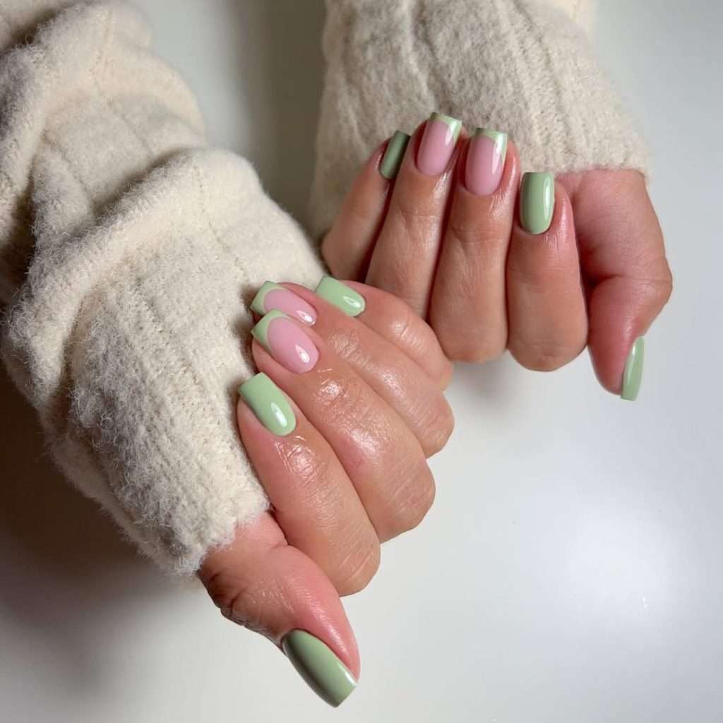 spring nails with alternating pistachio green and pink polish