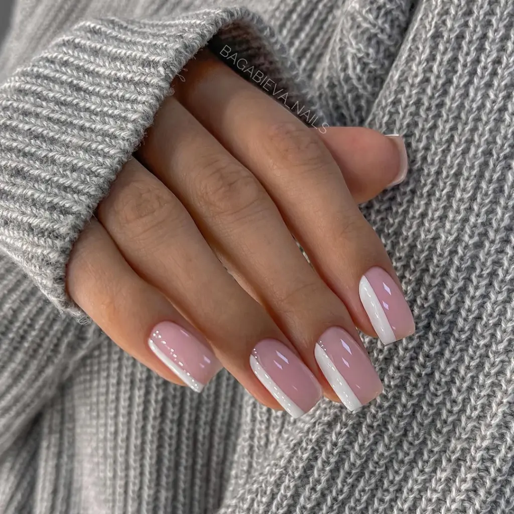 Square minimalist nails with pink base and clean white vertical side stripes on each nail