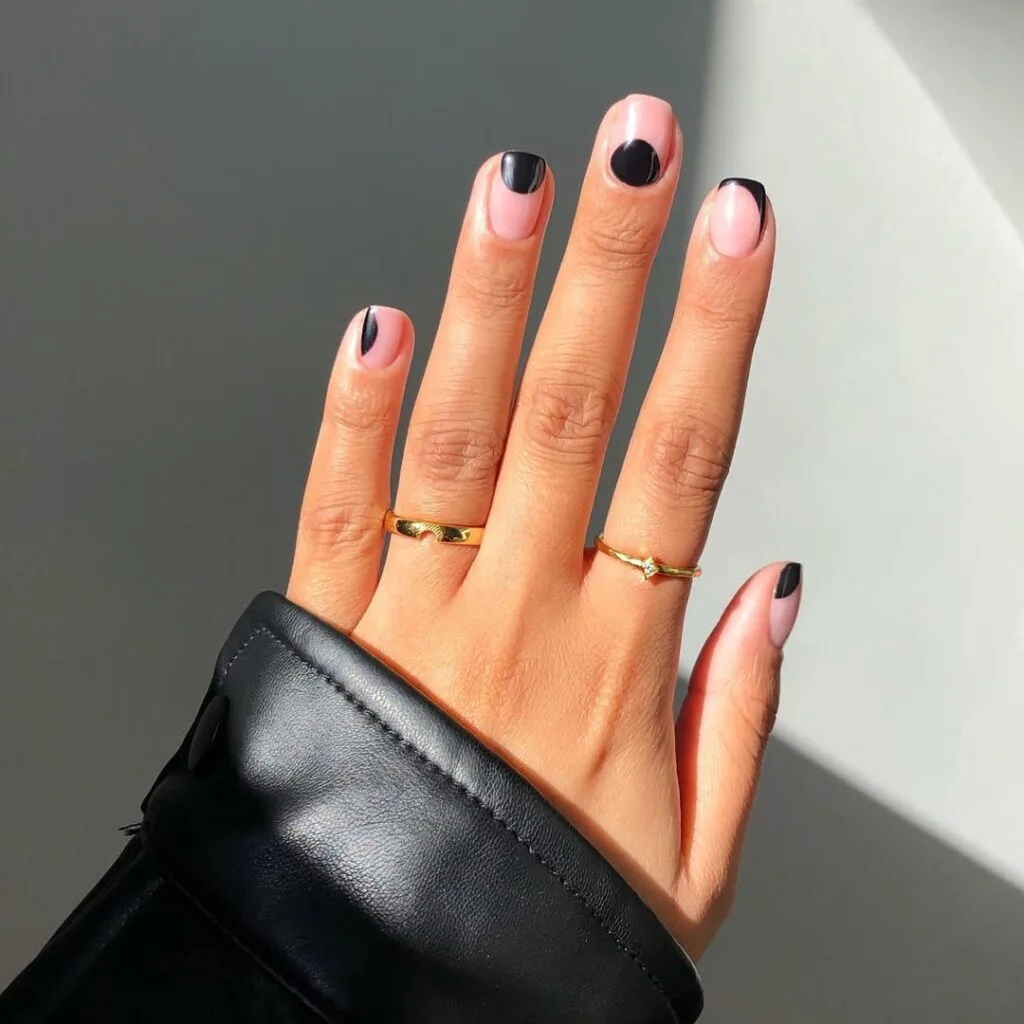 Short square minimalist nails with pink base and glossy black abstract half dip accent on each nail