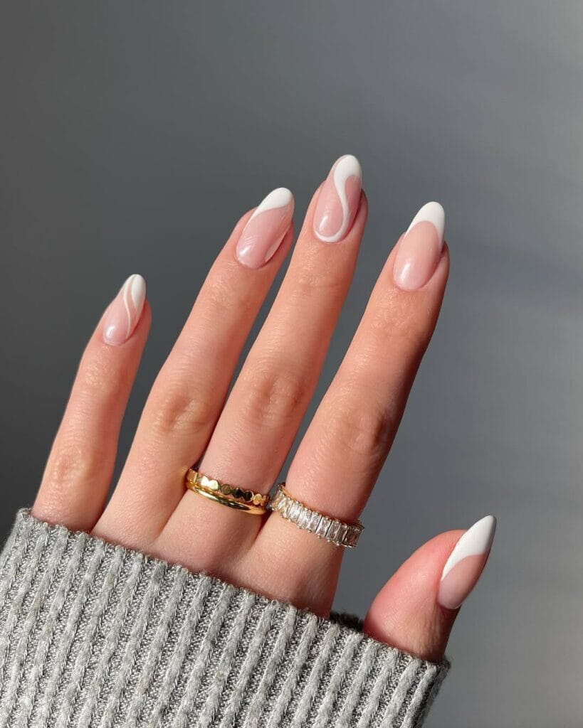Almond minimalist nails with nude pink base and white abstract swirl designs flowing into tips