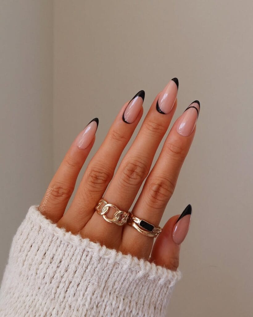 Almond minimalist nails with nude pink base and ultra-thin black curved French tip lines