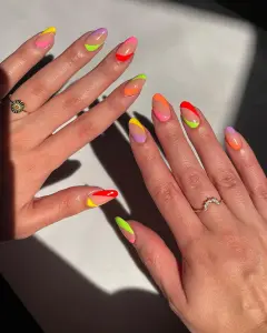 summer neon side stroke nails with bright colors on a natural base